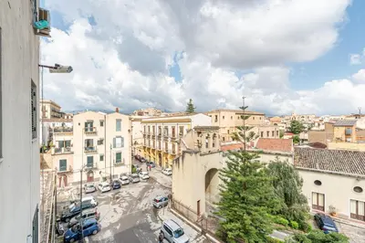 a view of a city with cars parked on a street at Lumar Sicilia - Magione in Palermo