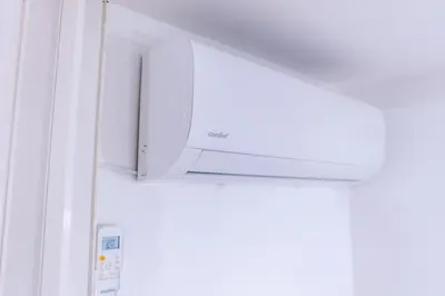 a white microwave oven sitting on top of a refrigerator at Lumar Sicilia - Cattedrale in Palermo