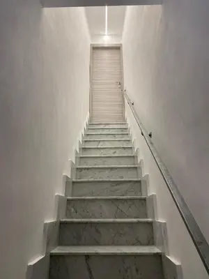 a staircase leading up to a door in a building at Casa Nonna Lina in Isola delle Femmine