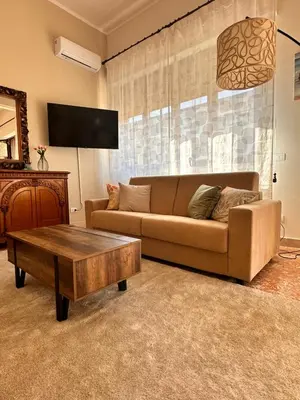 a living room with a couch and a coffee table at Kasa Stabile in Palermo