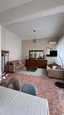 a living room with a couch and a table at Kasa Stabile in Palermo