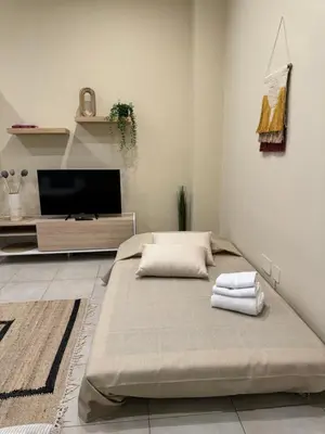 a living room with a couch and a tv at Domus Fysi in Palermo