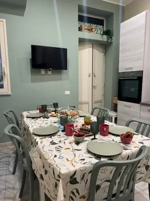 a table with food and drinks on it in a kitchen at Domus Fysi in Palermo