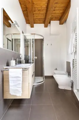 a bathroom with a shower and a sink and a toilet at Cassari Maisons in Palermo