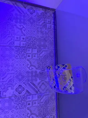 a purple room with a wall with a wallpaper at Karma House in Palermo