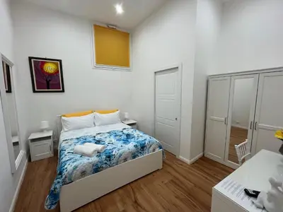 a small bedroom with a bed in a room at Aurora Center City - Rooms in Palermo