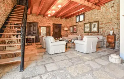 a living room with white chairs and a staircase at 3 Bedroom Amazing Home In Partinico in Partinico