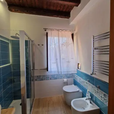 a bathroom with a toilet and a shower and a sink at Casa Kyla in Palermo