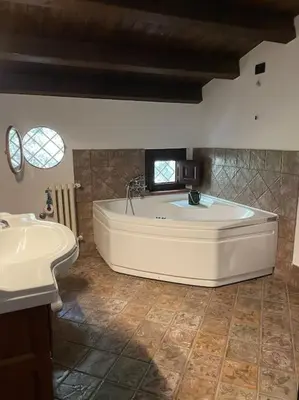 a large bathroom with a tub and a sink at Villa Rubino ai Colli in Palermo