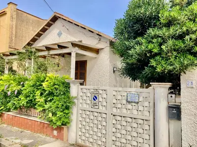 a white fence in front of a house at Villa Orlando Mondello in Palermo