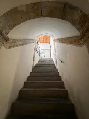 a staircase in an old building with a stair case at Masalia Loft in Palermo