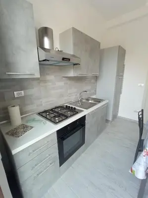 a kitchen with a stove and a sink at Makari Sweet Sunsets in Macari