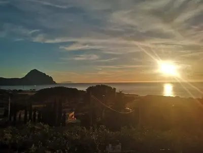 a view of the sun setting over the water at Makari Sweet Sunsets in Macari