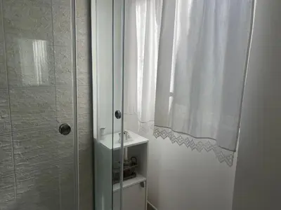 a bathroom with a shower and a shower curtain at Appartamento Florio in Palermo