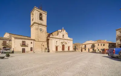 an old church with a clock tower on a street at Awesome Home In Palazzo Adriano in Palazzo Adriano