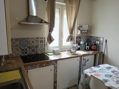 a kitchen with a counter top and a window at Virginia Holiday Home in Mondello