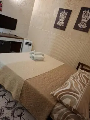 a room with a bed with two towels on it at LA TERRAZZA SUL MARE camera vicino aereoporto&mare SICILIAN VINTAGE STYLE SEASIDE ROOM in Cinisi
