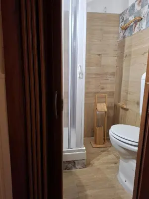 a bathroom with a toilet and a shower at LA TERRAZZA SUL MARE camera vicino aereoporto&mare SICILIAN VINTAGE STYLE SEASIDE ROOM in Cinisi
