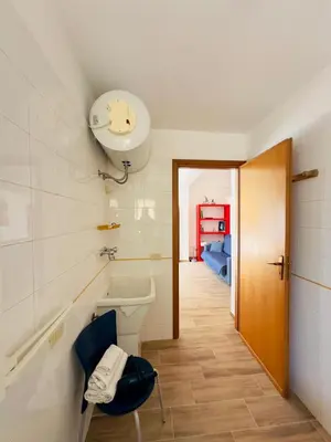 a bathroom with a sink and a toilet in a room at Balestrate Mare Centro Wi-Fi Self Check-in Aria Condizionata in Balestrate