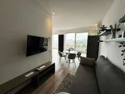 a living room with a couch and a table at Marina Rooftop Exclusive View in Palermo