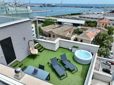 an image of a balcony with a pool and chairs at Marina Rooftop Exclusive View in Palermo
