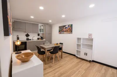 a kitchen and dining room with a table and chairs at aprimaManu apartment in Monreale