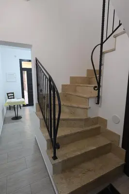 a staircase in a house with a stair railing at AL Quadrifoglio in Terrasini