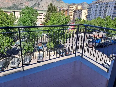 a balcony with a view of a parking lot at Appartamento Strasburgo in Palermo