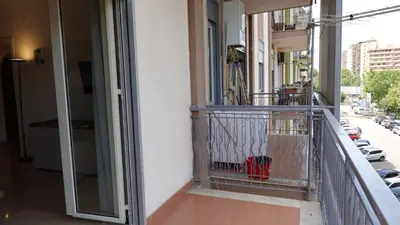 a balcony of a building with a fire hydrant on it at Appartamento Strasburgo in Palermo