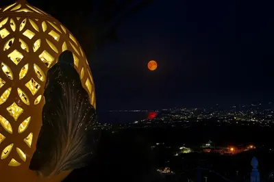 a view of a full moon at night at Antico Casale Formica in Bagheria