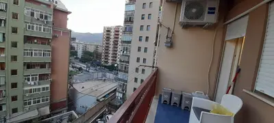 a balcony with a view of a city with buildings at AppartamentoBelgio in Palermo