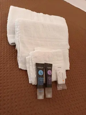 a group of towels and toothbrushes next to towels at B&B a casa di Peppe in Palermo