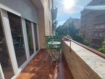 a balcony with a table and chairs on it at Teatro Massimo - Apartment with Private Balcony in Palermo
