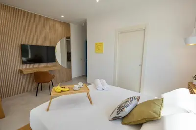 a bedroom with a bed and a table with bananas on it at BellaVista in Cinisi
