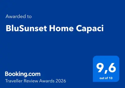 a blue sign with the text purchased to blursurs home cargo at BluSunset Home Capaci in Capaci