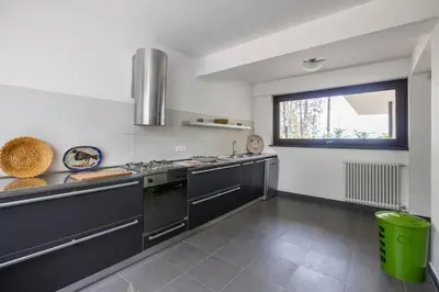 a kitchen with stainless steel appliances and a window at Villa Angelica by Wonderful Italy in Castellammare del Golfo