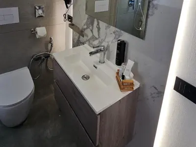 a bathroom with a sink and a toilet at Panhouse in Palermo