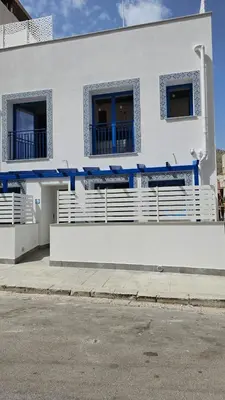 a white building with blue accents on it at Panhouse in Palermo