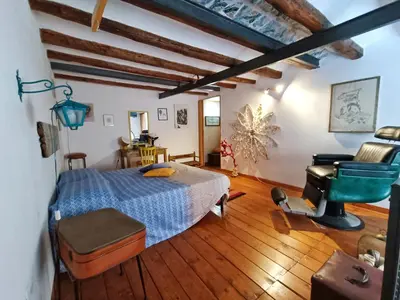 a bedroom with a bed and a sewing machine at Casuzza del mare in Castellammare del Golfo