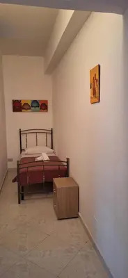 a bedroom with a bed and a wooden box at Sweet Dreams a casa di Alex in Palermo