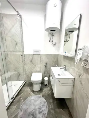 a bathroom with a shower and a toilet and a sink at Home Mia in Palermo