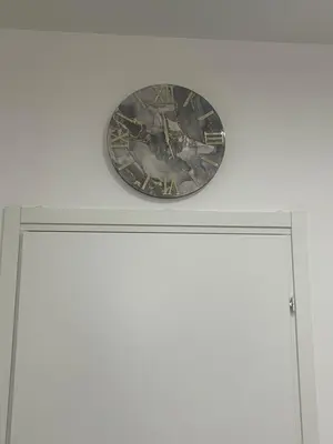 a clock on top of a white door at Home Mia in Palermo