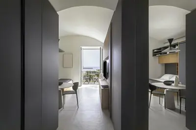 a small apartment with a bedroom and a dining room at Trinacria Marina Apartment in Palermo