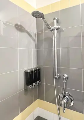 a shower with a shower head in a bathroom at A Casa Tua Palermo in Palermo