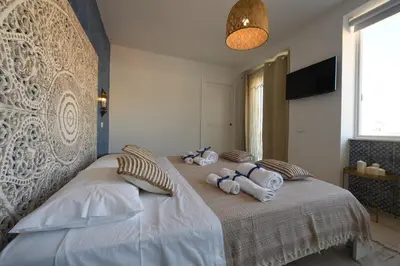 a bedroom with a bed with towels on it at Riad Casa Vacanze in Terrasini