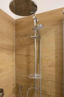 a shower with a stool and a shower head at Casa Marinù in Palermo
