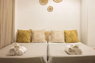 two beds sitting next to each other in a room at Casa Marinù in Palermo