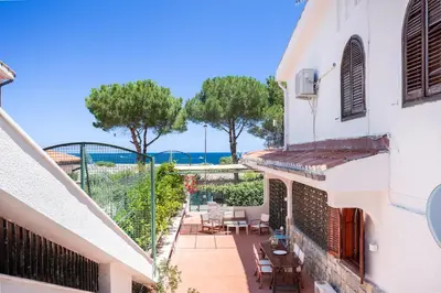 an apartment with a balcony with a view of the ocean at Le Casette all'Addaura by Domus Sicily in Mondello