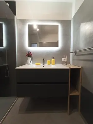 a bathroom with a sink and a mirror at Glocal flat Maqueda in Palermo
