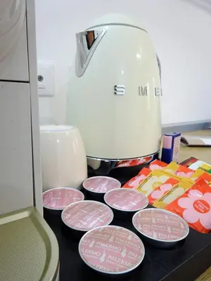 a kitchen counter with plates and a food processor at Sabatino Piazza Castelnuovo - Politeama in Palermo